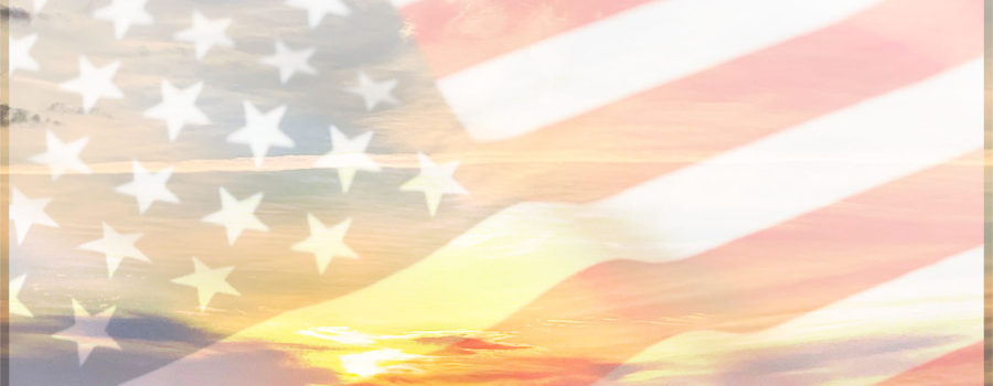 This photographic composite celebrates Veterans Day with an American landscape superimposed over the American flag.