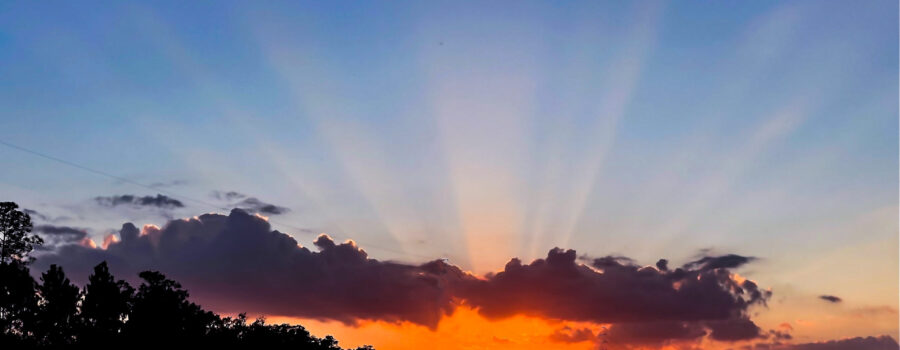 A very colorful sunset with bright sunbeam peaking out from behind the clouds was a treat for the drive home on Tuesday evening.