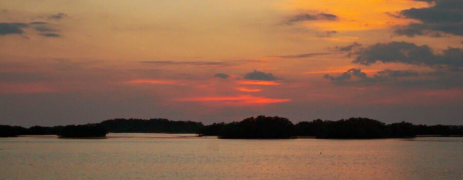 A colorful sunset at 7 pm by the water, makes one want to sit on the beach and relax the troubles of the day away.