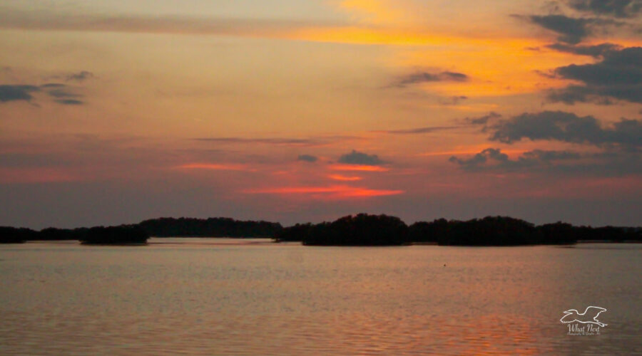 A colorful sunset at 7 pm by the water, makes one want to sit on the beach and relax the troubles of the day away.