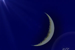 A sliver of a moon is emphasized with some special light effects.